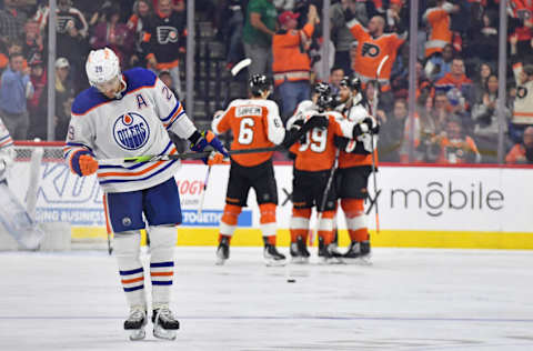 Oct 19, 2023; Philadelphia, Pennsylvania, USA; Edmonton Oilers center Leon Draisaitl (29) skates back to the bench as Philadelphia Flyers right wing Cam Atkinson (89) celebrates his goal with during the second period at Wells Fargo Center. Mandatory Credit: Eric Hartline-USA TODAY Sports