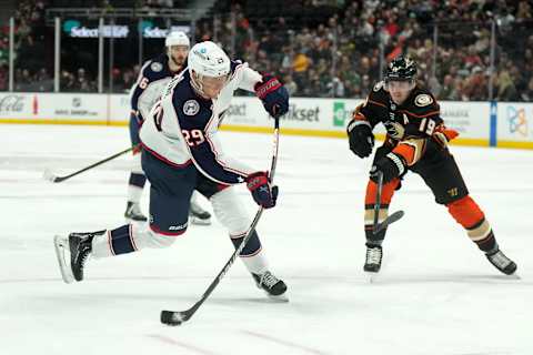 Mar 17, 2023; Anaheim, California, USA; Columbus Blue Jackets left wing Patrik Laine (29) shoots the puck against Anaheim Ducks right wing Troy Terry (19) in the third period at Honda Center. Mandatory Credit: Kirby Lee-USA TODAY Sports