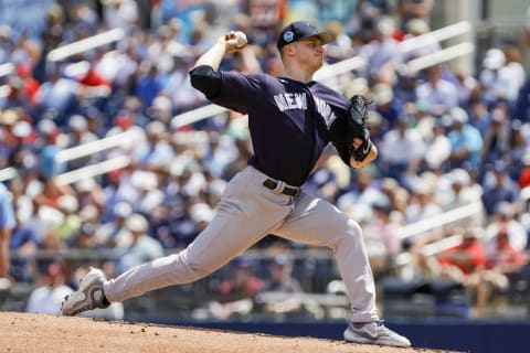 Mar 22, 2023; West Palm Beach, Florida, USA; New York Yankees starting pitcher Clarke Schmidt (86) delivers a pitch during the first inning against the Washington Nationals at The Ballpark of the Palm Beaches. Mandatory Credit: Sam Navarro-USA TODAY Sports