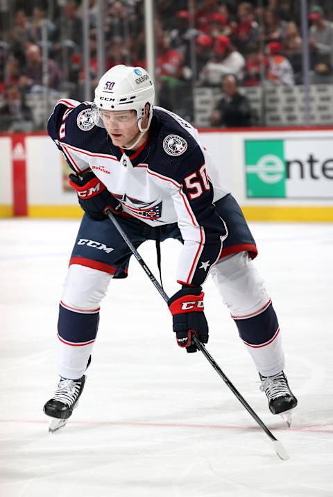 NEWARK, NEW JERSEY – APRIL 06: Eric Robinson #50 of the Columbus Blue Jackets prepares during a face off in the game against the New Jersey Devils at Prudential Center on April 06, 2023 in Newark, New Jersey. (Photo by Jamie Squire/Getty Images)