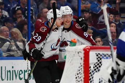 TAMPA, FL – DECEMBER 08: Colorado Avalanche center Nathan MacKinnon (29) celebrates with Colorado Avalanche right wing Mikko Rantanen (96) after scoring a goal in the first period of the NHL game between the Colorado Avalanche and Tampa Bay Lightning on December 08, 2018 at Amalie Arena in Tampa,FL. (Photo by Mark LoMoglio/Icon Sportswire via Getty Images)