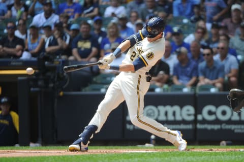 Jul 6, 2022; Milwaukee, Wisconsin, USA; Milwaukee Brewers left fielder Christian Yelich (22) grounds out against Chicago Cubs in the first inning at American Family Field. Mandatory Credit: Michael McLoone-USA TODAY Sports