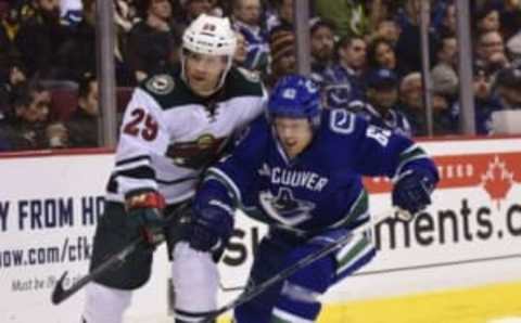 Nov 29, 2016; Vancouver, British Columbia, CAN; Vancouver Canucks defenseman Philip Larsen (63) battles for the puck against Minnesota Wild forward Jason Pominville (29) during the second period at Rogers Arena. Mandatory Credit: Anne-Marie Sorvin-USA TODAY Sports