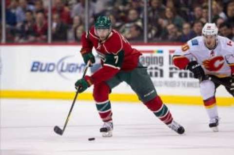 Feb 26, 2013; St. Paul, MN, USA; Minnesota Wild forward Matt Cullen (7) against the Calgary Flames at the Xcel Energy Center. The Wild defeated the Flames 2-1 in overtime. Mandatory Credit: Brace Hemmelgarn-USA TODAY Sports