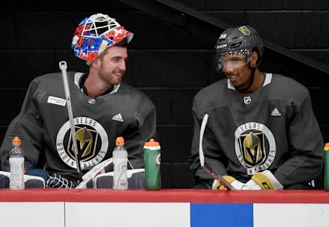 Goaltender Logan Thompson (L) and Keegan Kolesar #55 of the Vegas Golden Knights talk during a training camp practice. (Photo by Ethan Miller/Getty Images)