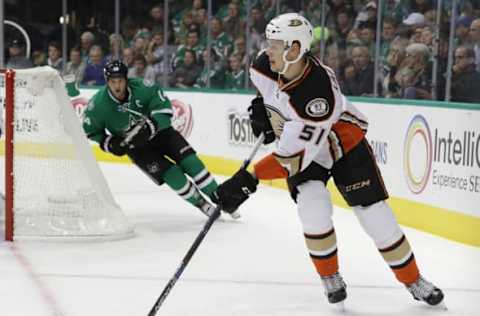 DALLAS, TX: Jacob Larsson #51 of the Anaheim Ducks skates the puck against the Dallas Stars on October 13, 2016. (Photo by Ronald Martinez/Getty Images)