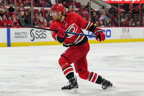 RALEIGH, NC – NOVEMBER 18: Carolina Hurricanes Defenceman Dougie Hamilton (19) follows through on a shot during a game between the Carolina Hurricanes and the New Jersey Devils at the PNC Arena in Raleigh, NC on November 18, 2018. (Photo by Greg Thompson/Icon Sportswire via Getty Images)