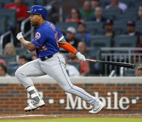 ATLANTA, GA – JUNE 12: First baseman Dominic Smith #22 of the New York Mets swings during the game against the Atlanta Braves at SunTrust Park on June 12, 2018 in Atlanta, Georgia. (Photo by Mike Zarrilli/Getty Images)