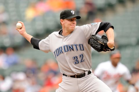 BALTIMORE – MAY 27: Roy Halladay #32 of the Toronto Blue Jays pitches against the Baltimore Orioles at Camden Yards on May 27, 2009 in Baltimore, Maryland. (Photo by G Fiume/Getty Images)