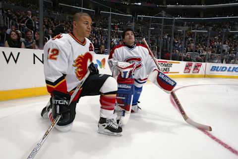 Jarome Iginla of the Calgary Flames and Jose Theodore of the Montreal Canadiens (Mandatory Credit: Robert LaBerge/Getty Images/NHLI)