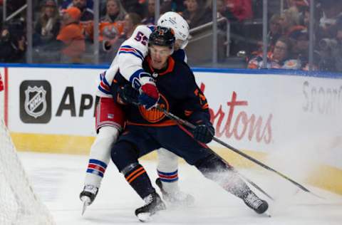 EDMONTON, AB – FEBRUARY 17: Ryan McLeod #71 of the Edmonton Oilers battles against Ryan Lindgren #55 of the New York Rangers during the second period of the game at Rogers Place on February 17, 2023, in Edmonton, Canada. (Photo by Codie McLachlan/Getty Images)