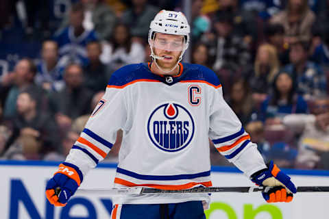 Oct 11, 2023; Vancouver, British Columbia, CAN; Edmonton Oilers forward Connor McDavid (97) reacts to the a goal being scored against the Vancouver Canucks in the second period at Rogers Arena. Mandatory Credit: Bob Frid-USA TODAY Sports