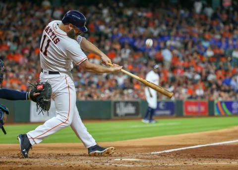 HOUSTON, TX – JUNE 05: Houston Astros designated hitter Evan Gattis (11) hits a foul ball in the bottom of the second inning during the baseball game between the Seattle Mariners and Houston Astros on June 5, 2018 at Minute Maid Park in Houston, Texas. (Photo by Leslie Plaza Johnson/Icon Sportswire via Getty Images)