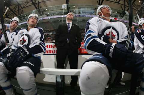 UNIONDALE, NY - APRIL 05: Winnipeg Jets assistant coach Pascal Vincent tends to bench duties against the New York Islanders at the Nassau Veterans Memorial Coliseum on April 5, 2012 in Uniondale, New York. The Islanders defeated the Jets 5-4. (Photo by Bruce Bennett/Getty Images)