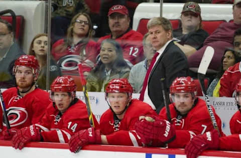 Apr 7, 2016; Raleigh, NC, USA; Carolina Hurricanes head coach Bill Peters (C) looks on from behind the bench against the Montreal Canadiens during the third period at PNC Arena. The Canadiens won 4-2. Mandatory Credit: James Guillory-USA TODAY Sports