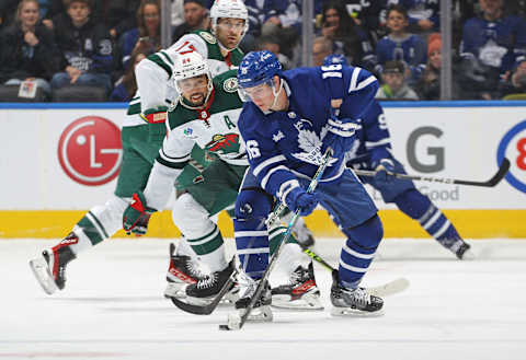 Matt Dumba #24 of the Minnesota Wild contains Mitch Marner #16 of the Toronto Maple Leafs (Photo by Claus Andersen/Getty images)