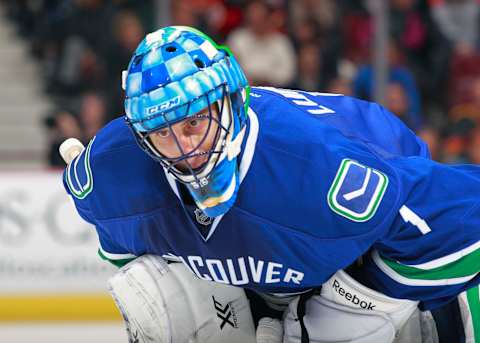 VANCOUVER, BC – NOVEMBER 23: Roberto Luongo #1 of the Vancouver Canucks skates to the bench during their NHL game against the Chicago Blackhawks at Rogers Arena on November 23, 2013 in Vancouver, British Columbia, Canada. Chicago won 2-1. (Photo by Jeff Vinnick/NHLI via Getty Images)