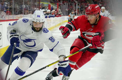 RALEIGH, NC – JANUARY 05: Carolina Hurricanes Defenceman Brett Pesce (22) chases Tampa Bay Lightning Right Wing Nikita Kucherov (86) around the boards during a game between the Tampa Bay Lightning and the Carolina Hurricanes on January 5, 2020 at the PNC Arena in Raleigh, NC. (Photo by Greg Thompson/Icon Sportswire via Getty Images)