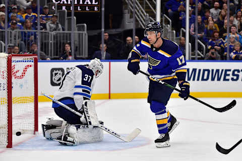 St. Louis Blues, Jaden Schwartz (17); Winnipeg Jets, Connor Hellebuyck (37) Mandatory Credit: Jeff Curry-USA TODAY Sports