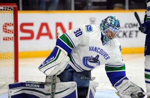 Mar 24, 2016; Nashville, TN, USA; Vancouver Canucks goalie Ryan Miller (30) makes a save during the first period against the Nashville Predators at Bridgestone Arena. Mandatory Credit: Christopher Hanewinckel-USA TODAY Sports