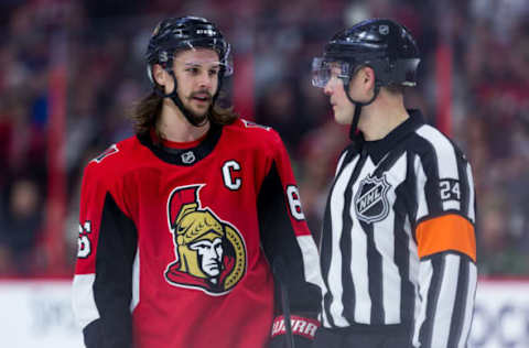 OTTAWA, ON – APRIL 02: Ottawa Senators Defenceman Erik Karlsson (65) talks to Referee Graham Skilliter (24) during third period National Hockey League action between the Winnipeg Jets and Ottawa Senators on April 2, 2018, at Canadian Tire Centre in Ottawa, ON, Canada. (Photo by Richard A. Whittaker/Icon Sportswire via Getty Images)