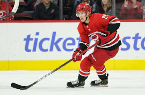 RALEIGH, NC – OCTOBER 29: Carolina Hurricanes Right Wing Martin Necas (88) skirts with the puck during a game between the Calgary Flames and the Carolina Hurricanes at the PNC Arena in Raleigh, NC on October 29, 2019. (Photo by Greg Thompson/Icon Sportswire via Getty Images)