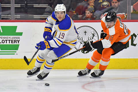 Apr 17, 2022; Philadelphia, Pennsylvania, USA; Buffalo Sabres center Peyton Krebs (19) controls the puck against Philadelphia Flyers left wing Joel Farabee (86) during the third period at Wells Fargo Center. Mandatory Credit: Eric Hartline-USA TODAY Sports