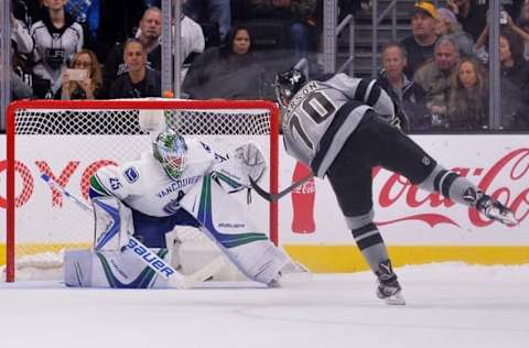 Oct 22, 2016; Los Angeles, CA, USA; Los Angeles Kings left wing Tanner Pearson (70) scores a goal as Vancouver Canucks goalie Jacob Markstrom (25) defends the net during a shootout at Staples Center. Mandatory Credit: Jake Roth-USA TODAY Sports