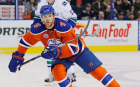 Mar 18, 2016; Edmonton, Alberta, CAN; Edmonton Oilers forward Taylor Hall (4) looks for a pass against the Vancouver Canucks at Rexall Place. Mandatory Credit: Perry Nelson-USA TODAY Sports