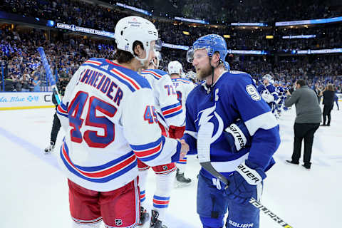 TAMPA, FLORIDA – JUNE 11: Steven Stamkos #91 of the Tampa Bay Lightning shakes hands with Braden Schneider #45 of the New York Rangers after Game Six of the Eastern Conference Final of the 2022 Stanley Cup Playoffs at Amalie Arena on June 11, 2022 in Tampa, Florida. (Photo by Andy Lyons/Getty Images)