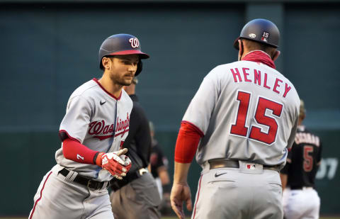 May 14, 2021; Phoenix, Arizona, USA; Washington Nationals shortstop Trea Turner (7) celebrates with third base coach Bob Henley (15) after hitting a solo home run against the Arizona Diamondbacks in the first inning at Chase Field. Mandatory Credit: Rick Scuteri-USA TODAY Sports