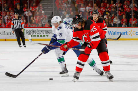 NEWARK, NJ – DECEMBER 31: Loui Eriksson #21 of the Vancouver Canucks in action against Sami Vatanen #45 of the New Jersey Devils. (Photo by Jim McIsaac/Getty Images)