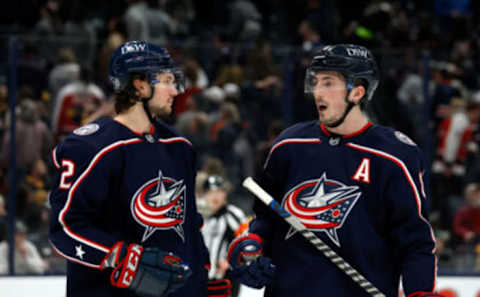 COLUMBUS, OH – APRIL 04: Zach Werenski #8 of the Columbus Blue Jackets talks with Andrew Peeke #2 during the game against the Boston Bruins at Nationwide Arena on April 4, 2022 in Columbus, Ohio. Boston defeated Columbus 3-2 in overtime. (Photo by Kirk Irwin/Getty Images)