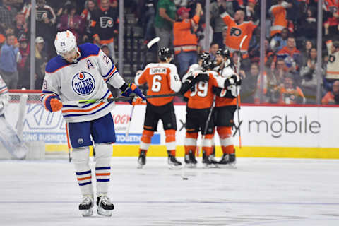 Oct 19, 2023; Philadelphia, Pennsylvania, USA; Edmonton Oilers center Leon Draisaitl (29) skates back to the bench as Philadelphia Flyers right wing Cam Atkinson (89) celebrates his goal during the second period at Wells Fargo Center. Mandatory Credit: Eric Hartline-USA TODAY Sports