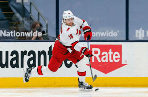 Mar 25, 2021; Columbus, Ohio, USA; Carolina Hurricanes defenseman Dougie Hamilton (19) shoots on goal against the Columbus Blue Jackets during the second period at Nationwide Arena. Mandatory Credit: Russell LaBounty-USA TODAY Sports