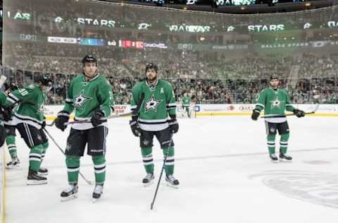 NHL Power Rankings: Dallas Stars center Jason Spezza (90) and left wing Lauri Korpikoski (38) and center Tyler Seguin (91) and defenseman Dan Hamhuis (2) wait for play to resume against the Calgary Flames during the third period at the American Airlines Center. The Flames defeat the Stars 2-1. Mandatory Credit: Jerome Miron-USA TODAY Sports