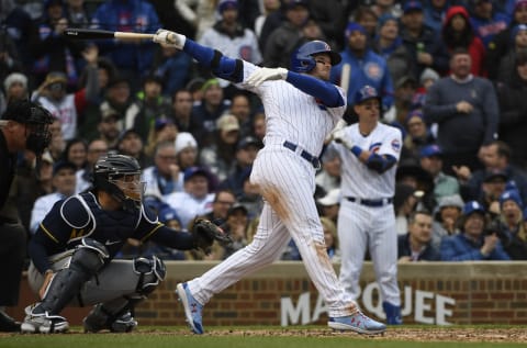 Apr 7, 2022; Chicago, Illinois, USA; Chicago Cubs center fielder Ian Happ (8) hits a two run double against the Milwaukee Brewers during the seventh inning at Wrigley Field. Mandatory Credit: Matt Marton-USA TODAY Sports