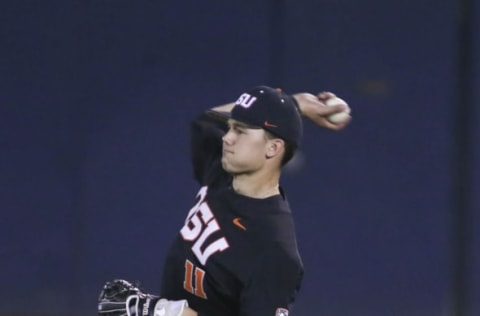 TUCSON, AZ – APRIL 07: Oregon State Beavers outfielder Trevor Larnach (11) throws the ball during a college baseball game between Oregon State Beavers and the Arizona Wildcats on April 07, 2018, at Hi Corbett Field in Tucson, AZ. (Photo by Jacob Snow/Icon Sportswire via Getty Images)