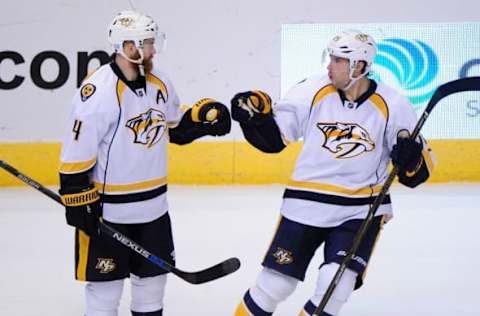 Nov 3, 2016; Glendale, AZ, USA; Nashville Predators right wing Craig Smith (15) celebrates with defenseman Ryan Ellis (4) after scoring a power play goal in the second period against Arizona Coyotes at Gila River Arena. Mandatory Credit: Matt Kartozian-USA TODAY Sports