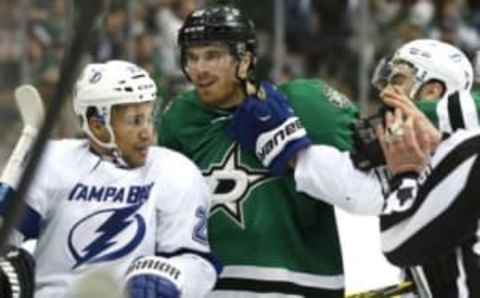 Mar 17, 2016; Dallas, TX, USA; Dallas Stars defenseman Stephen Johns (28) looks at Tampa Bay Lightning right wing J.T. Brown (23) in the third period at American Airlines Center. The Stars won 4-3. Mandatory Credit: Tim Heitman-USA TODAY Sports