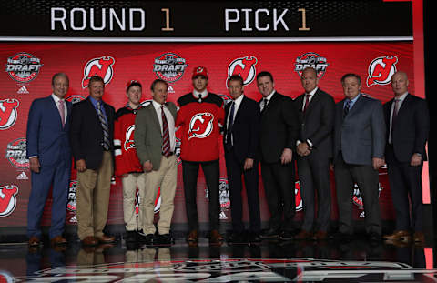 CHICAGO, IL – JUNE 23: (L-R) General manager Ray Shero, draft team member, draft runner Thomas Harris, owner Josh Harris, first overall pick Nico Hischier, director of amateur scouting Paul Castron, director of player personnel Dan MacKinnon, assistant general manager Tom Fitzgerald, assistant director of amateur scouting Gates Orlando and head coach John Hynes of the New Jersey Devils pose for a photo onstage during Round One of the 2017 NHL Draft at United Center on June 23, 2017 in Chicago, Illinois. (Photo by Dave Sandford/NHLI via Getty Images)