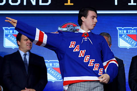 CHICAGO, IL – JUNE 23: Filip Chytil puts on the New York Rangers jersey after being selected 21st overall during the 2017 NHL Draft at the United Center on June 23, 2017 in Chicago, Illinois. (Photo by Bruce Bennett/Getty Images)