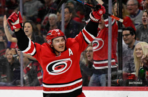 RALEIGH, NORTH CAROLINA – MARCH 22: Sebastian Aho #20 of the Carolina Hurricanes celebrates his goal against the Tampa Bay Lightning during the third period at PNC Arena on March 22, 2022, in Raleigh, North Carolina. (Photo by Eakin Howard/Getty Images)