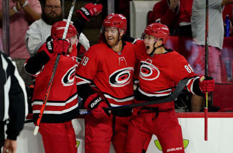 RALEIGH, NC – OCTOBER 3: Martin Necas #88 of the Carolina Hurricanes celebrates with teammates Dougie Hamilton #19 and Andrei Svechnikov #37 after scoring his first career power play goal during an NHL game against the Montreal Canadiens on October 3, 2019 at PNC Arena in Raleigh North Carolina. (Photo by Gregg Forwerck/NHLI via Getty Images)