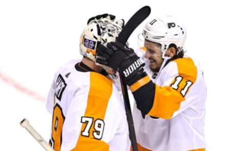 Carter Hart and Travis Konecny, Philadelphia Flyers (Photo by Elsa/Getty Images)