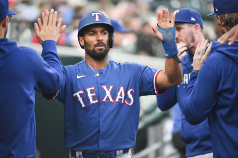 May 30, 2023; Detroit, Michigan, USA; Texas Rangers second baseman Marcus Semien (2) celebrates his run with teammates during the fifth inning against the Detroit Tigers at Comerica Park. Mandatory Credit: Tim Fuller-USA TODAY Sports