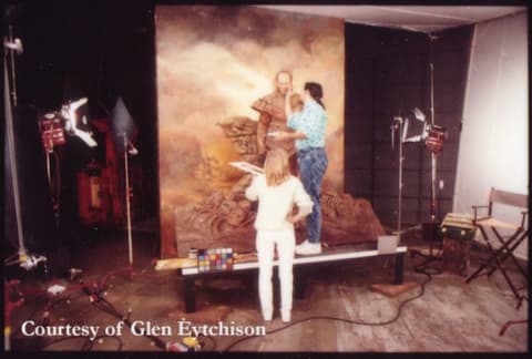 Mike Smithson applies makeup to von Homburg, while sculptor Judy Park holds a palette.