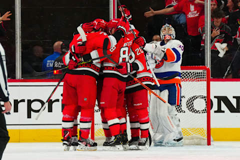 Apr 17, 2023; Raleigh, North Carolina, USA; Carolina Hurricanes right wing Stefan Noesen (23) celebrates his goal with center Sebastian Aho (20) defenseman Brent Burns (8) center Martin Necas (88) and center Seth Jarvis (24) against the New York Islanders during the second period in game one of the first round of the 2023 Stanley Cup Playoffs at PNC Arena. Mandatory Credit: James Guillory-USA TODAY Sports