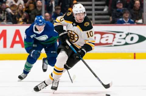 VANCOUVER, BC – FEBRUARY 22: Anders Bjork #10 of the Boston Bruins skates with the puck during NHL action against the Vancouver Canucks at Rogers Arena on February 22, 2020 in Vancouver, Canada. (Photo by Rich Lam/Getty Images)