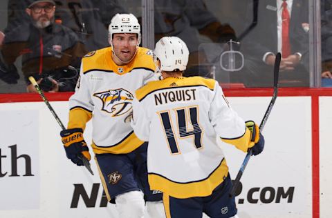 Jake Livingstone #23 of the Nashville Predators celebrates his second-period goal with Gustav Nyquist #14 during a preseason game at the Amerant Bank Arena on September 25, 2023 in Sunrise, Florida. (Photo by Joel Auerbach/Getty Images)